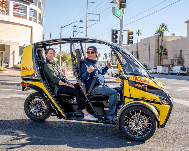 2 people in gocar on street