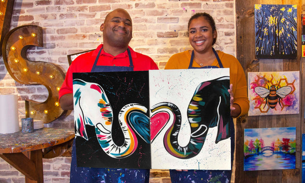2 people with paintings that match