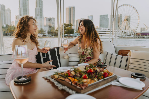 friends on a boat with wine