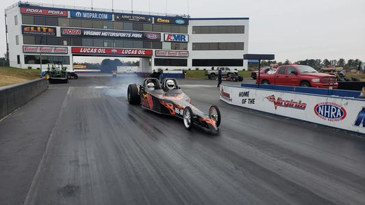 2 person dragster driving on a track