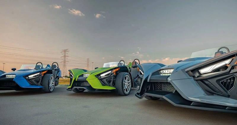 3-day-polaris-slingshot-rental-houston-three-color-fleet-sunset.webp