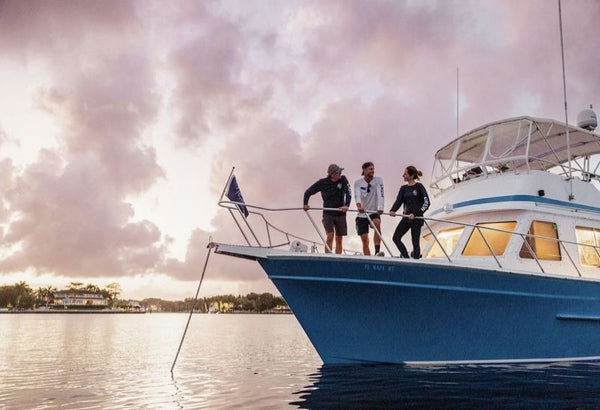 3 people on yacht