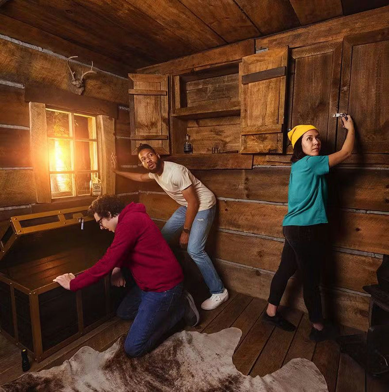 3 people searching in cabin