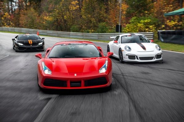 3 sports cars racing on track