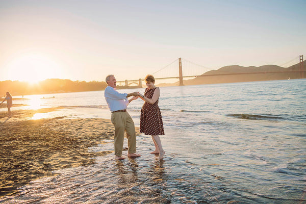 couple in water at Golden Gate Bridge