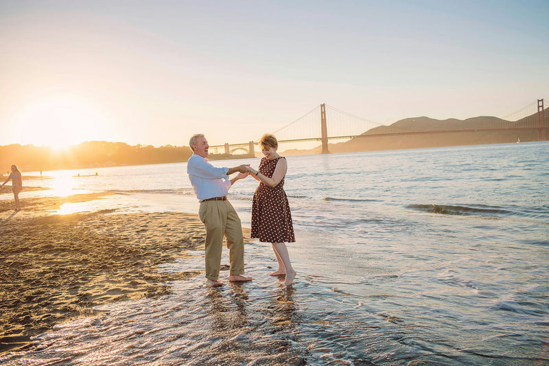 couple in water at Golden Gate Bridge