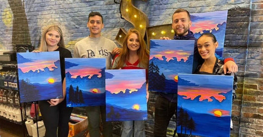 5 people with sunset paintings