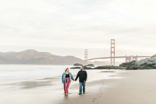 couple in water at Golden Gate Bridge