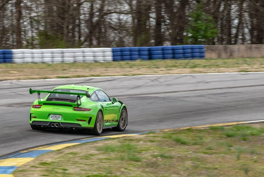 Green Porsche on track 1