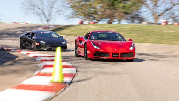 Cars racing on track