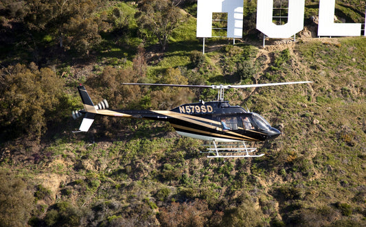 Close up of helicopter in front of Hollywood sign
