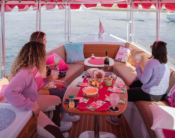Girls on boat with snacks.png
