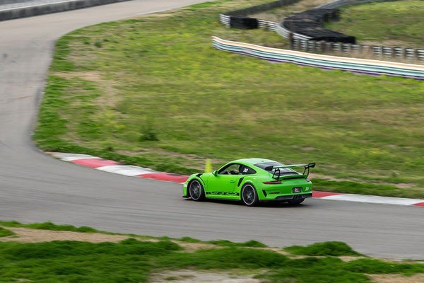 Green Porsche GT on track