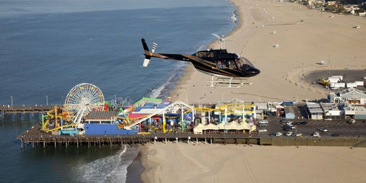 Helicopter flying over beach