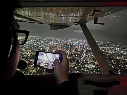 Taking photo from airplane at night