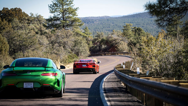 Xred and green sports car in mountains
