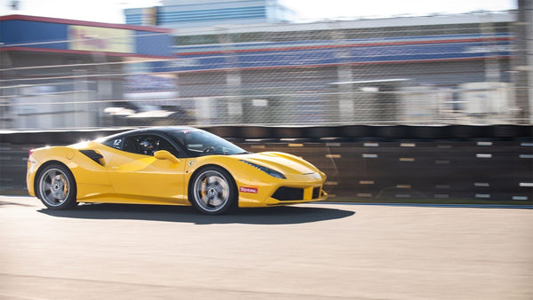 Yellow Ferrari on track