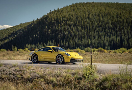 Yellow supercar on road