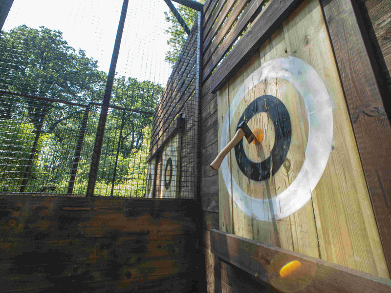 an-axe-in-a-target-with-another-target-in-the-background