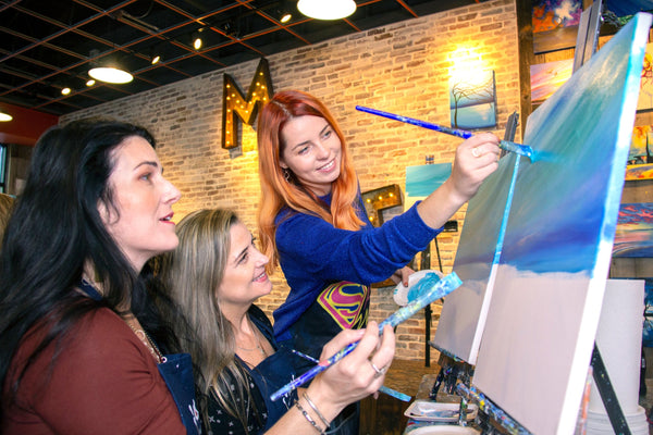 artists helping with painting