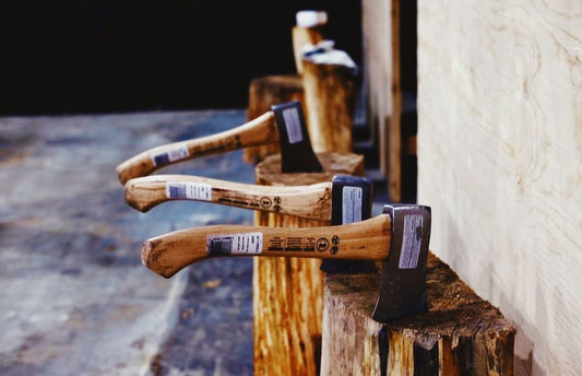 axes in wood chunk