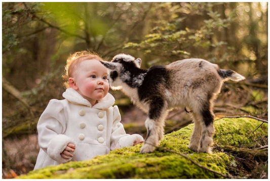 baby with goat.jpeg