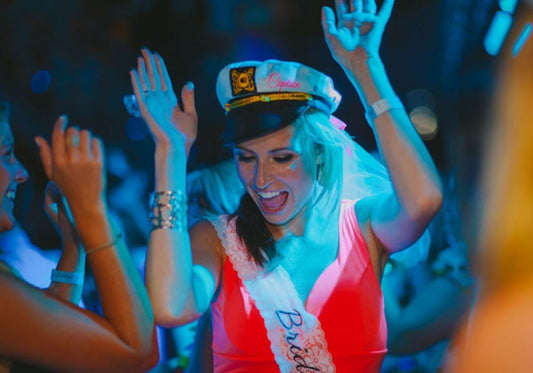 bachelorette with captains hat on party boat