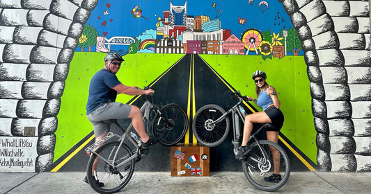 bikers with mural.jpeg