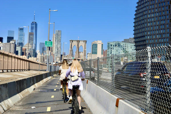 posing with brooklyn bridge and bikes