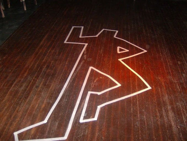 body outline in tape on floor