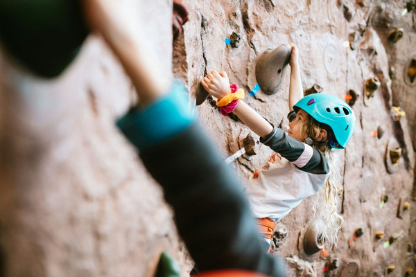 boy rock climbing