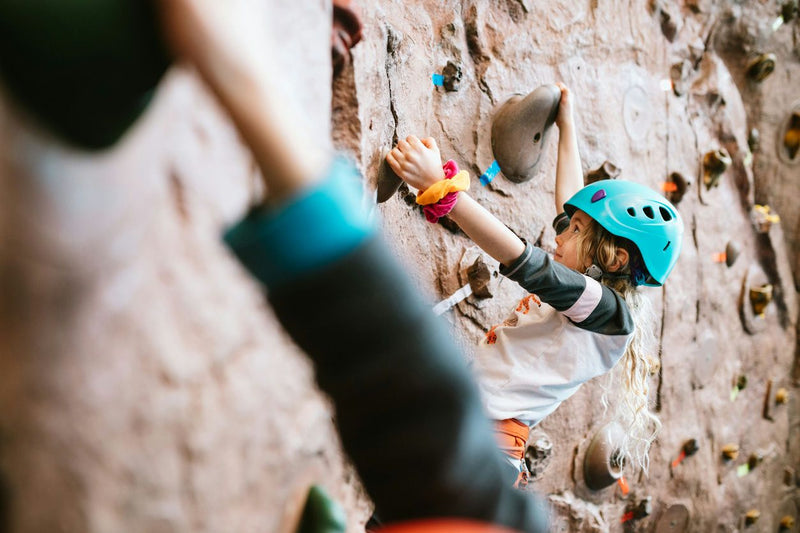 boy rock climbing
