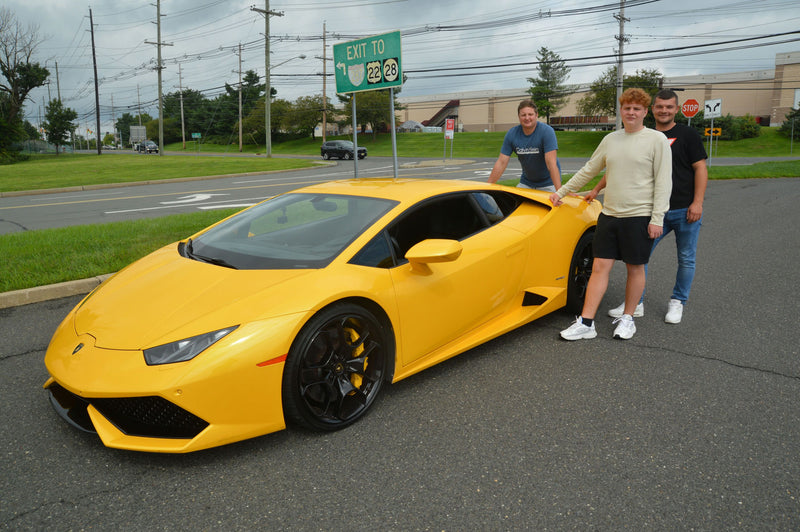 boys with yellow car