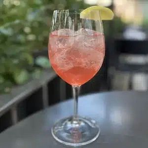 cheersing in restaurant with cocktails