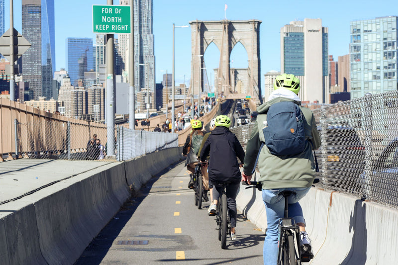 brooklyn-bridge-bike-rental-nyc-riding-across-bridge.png