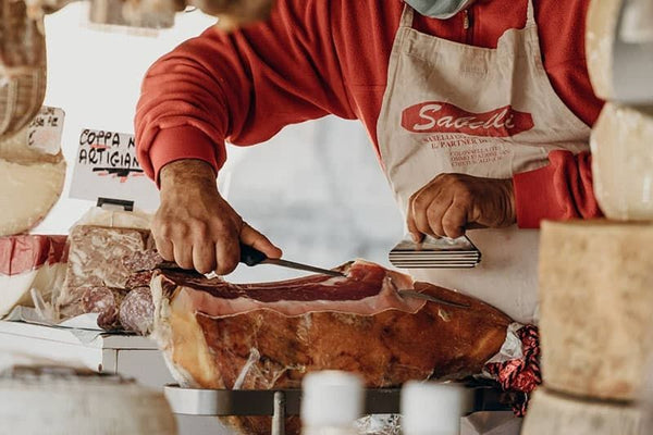 butcher shaving proscuito