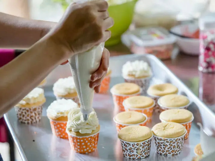buttercream-cupcake-decorating-class-washington-dc-piping-frosting.webp