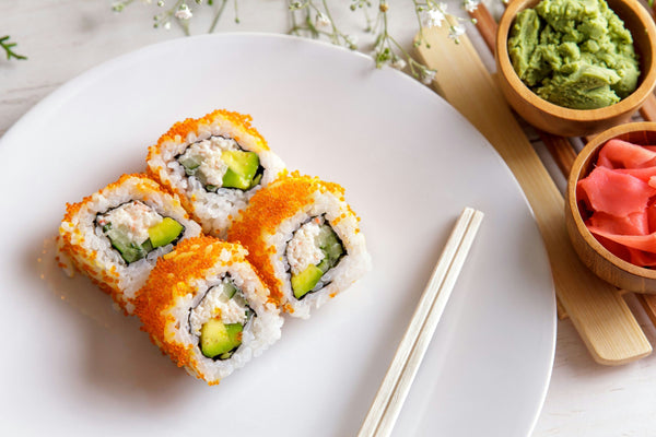 Chopping fresh cucumber into thin strips for sushi.jpg