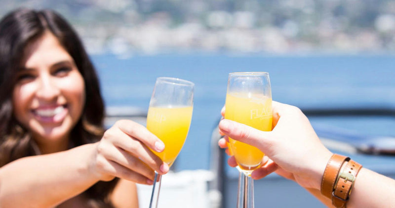 cheers on boat with mimosas.jpg