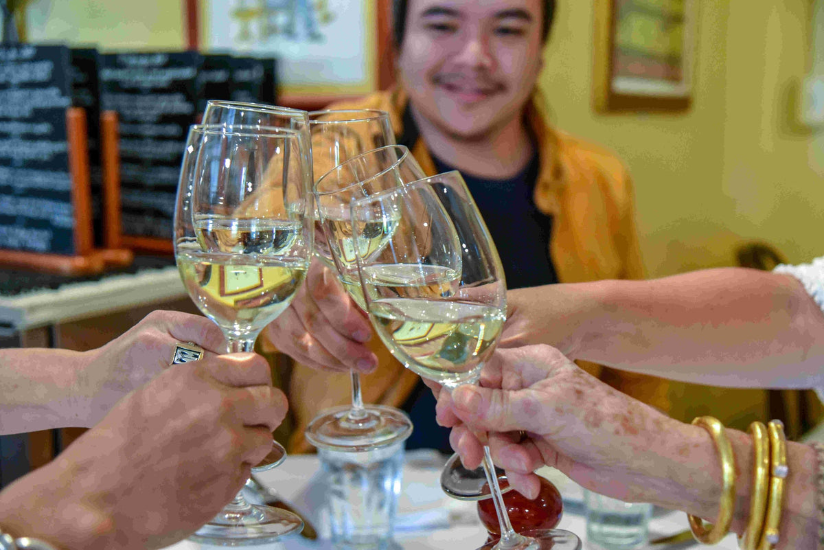 cheers-with-4-glasses-of-white-wine