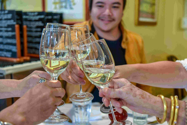 cheers-with-4-glasses-of-white-wine