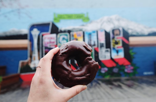 chocolate donut with a bite out of it