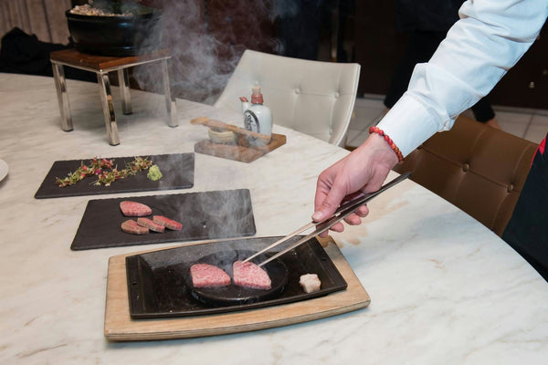 cooking-meat-at-table