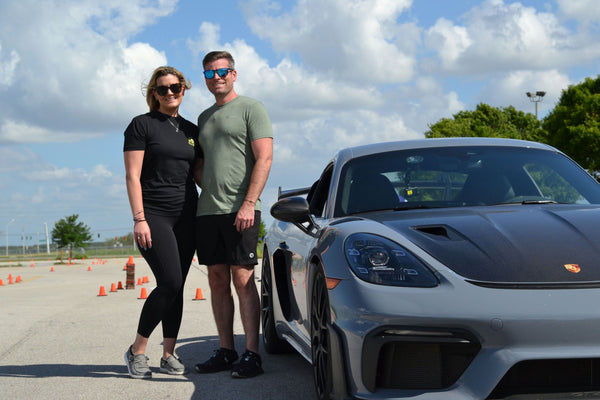 couple and super car