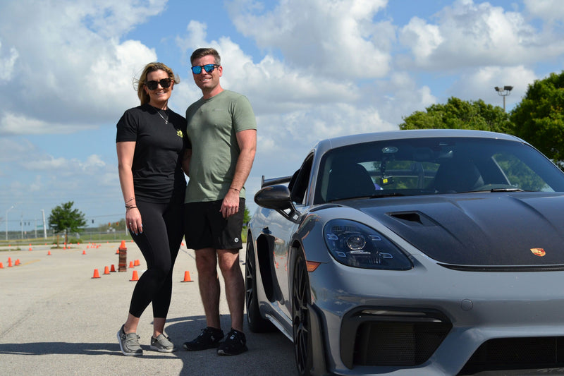 couple and super car