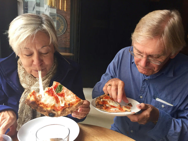 Couple eating pizza