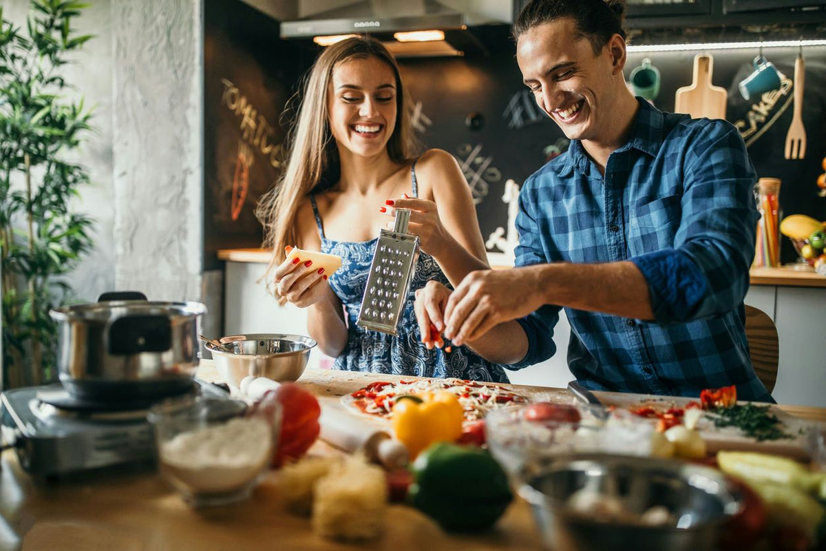 couple-grating-cheese