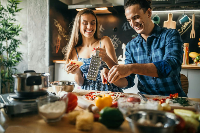 couple-grating-cheese