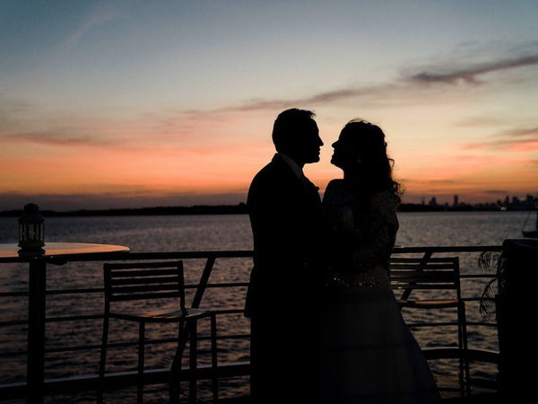 couple kissing at sunset
