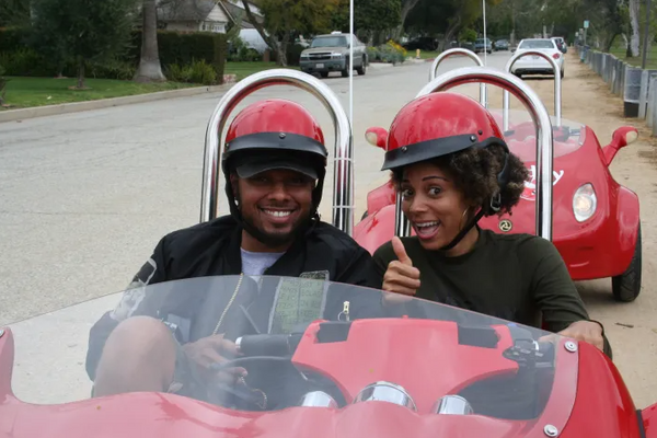 Couple on scooter tour.png